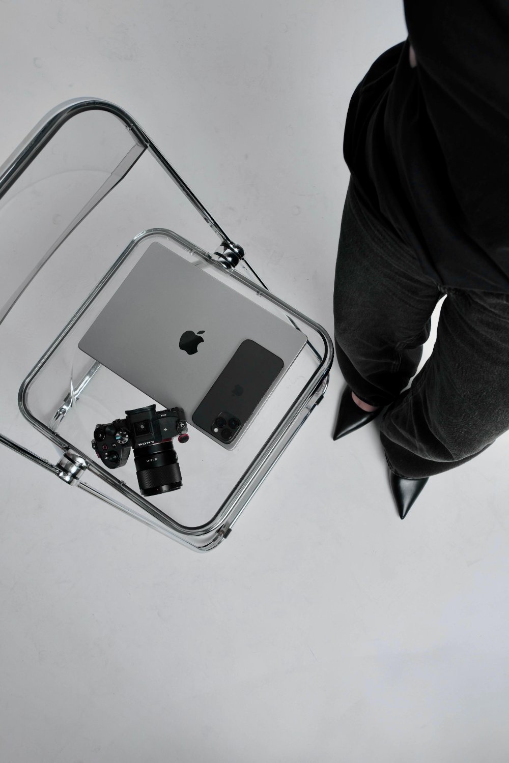 A creator's laptop, phone and camera